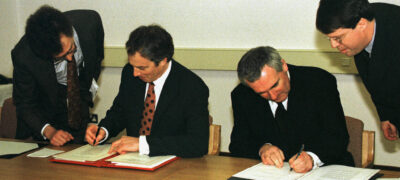 British Prime Minister Tony Blair (L) and Irish Prime Minister Bertie Ahern sign the peace agreement April 10. The leaders stated that the people of Northern Ireland will now decide democratically their own future. IRISH TALKS - RP1DRIFCVMAB
