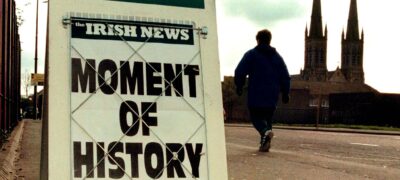 A newspaper billboard on the Falls Road, west Belfast, reports the expected agreement in the peace talks April 10. The parties talked throughout the night, well past the midnight deadline, trying to finalise the details of a peace settlement almost 30 years after violence began in Northern Ireland. - PBEAHUMAQCL