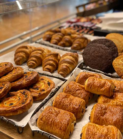 A selection of croissants and cookies.