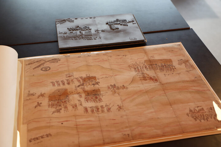 The tactile version of the Carberry Hill image next to the original. It is about a quarter of the size of the original.