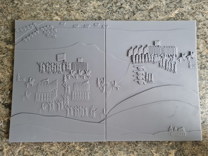 Tactile version of the illustration described above, rendered in grey resin. The details of the illustration are raised and simplified.