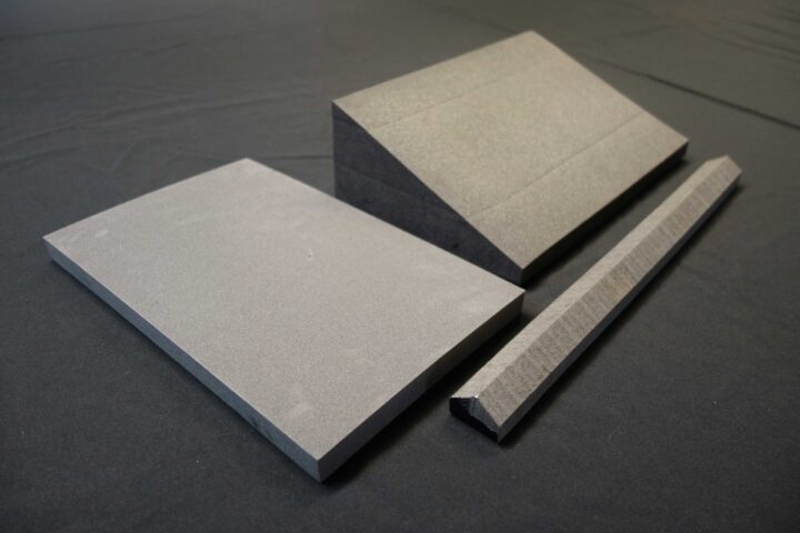 A group of three foam supports to assist with handling. They include a flat rectangular pad, a triangular wedge, and a thin, long arched foam support. 