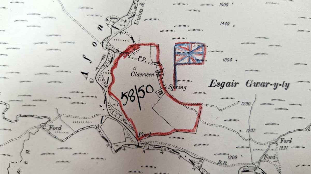 An area of map marked in red pencil, with a sketch of a Union flag next to it.
