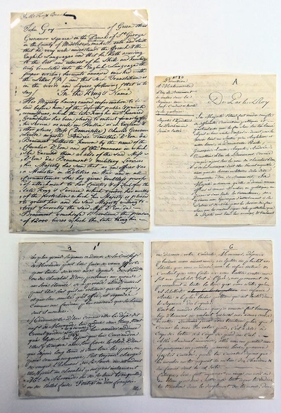 Four handwritten letters placed on a table.