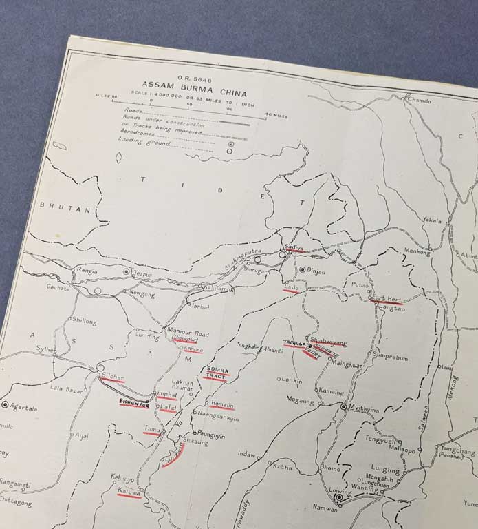 Corner of a printed map labelled 'ASSAM BURMA CHINA', with particular cities underlined in red pencil.