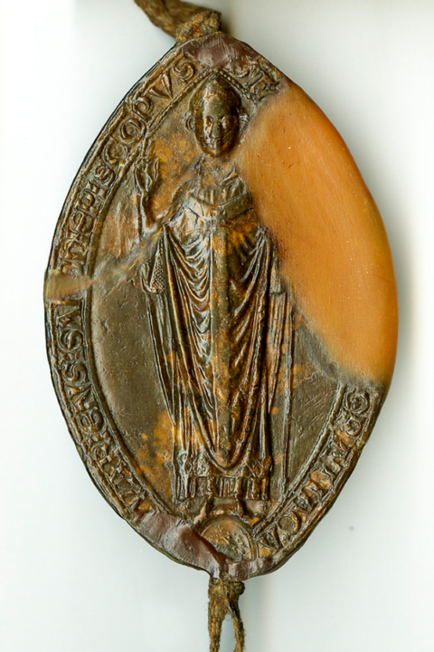Front (obverse) of an oval seal showing Archbishop Stephen Langton wearing a mitre and holding a staff. There is a legend around the edge of the seal. 