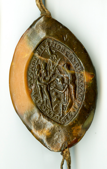 Back (reverse) of the seal shows the murder of Thomas Becket when kneeling in prayer by knights holding swords. There is a legend around the edge of the seal.