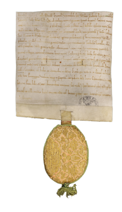 Parchment document written in Latin attached to a decorated yellow fabric pouch with a green tassel used to hold a seal.