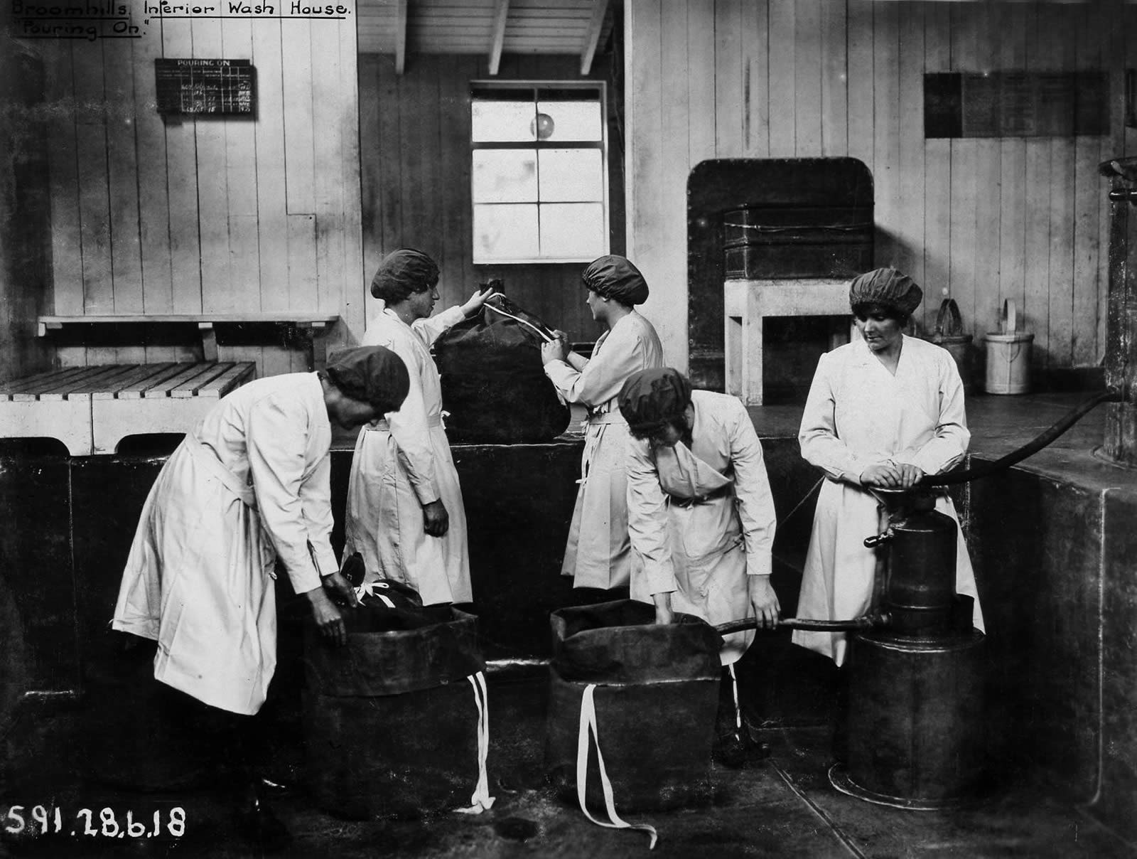Image of five women working in a wash house