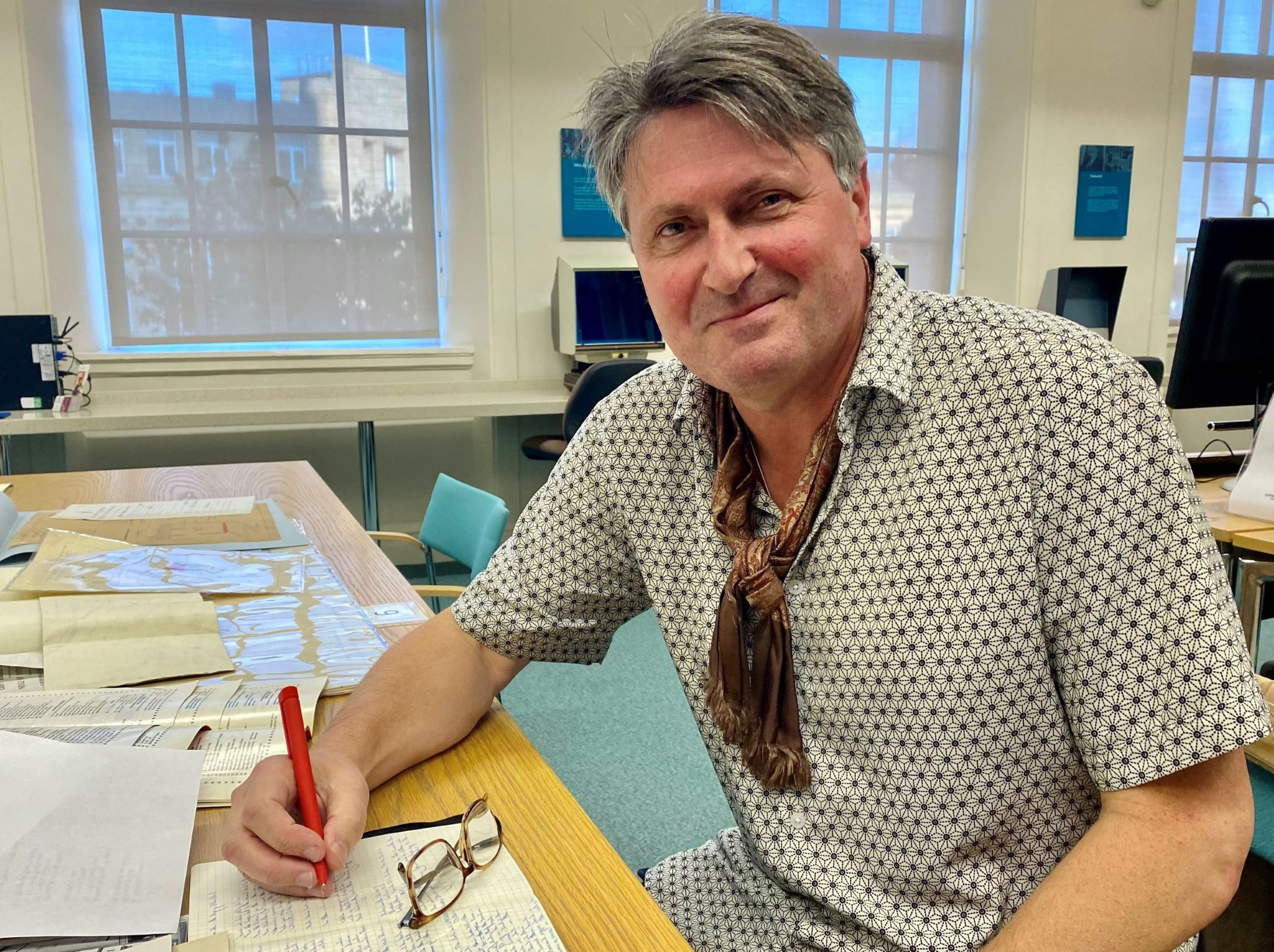 Poet Laureate Simon Armitage in an archive searchroom