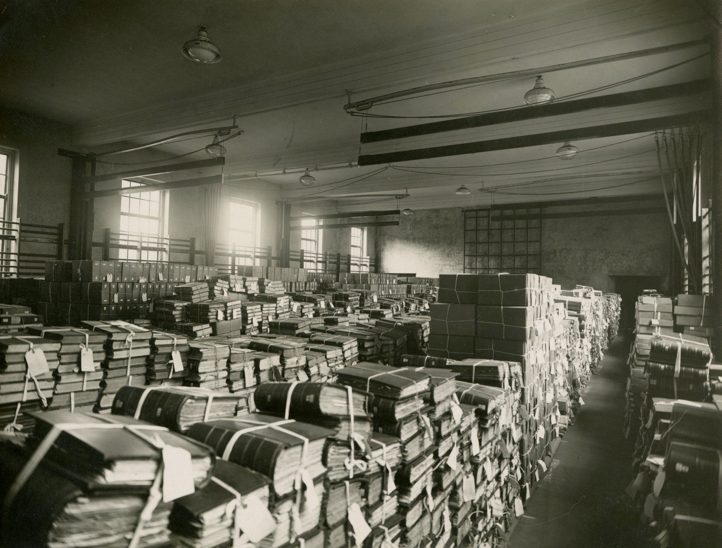 Records in tall piles in a large room