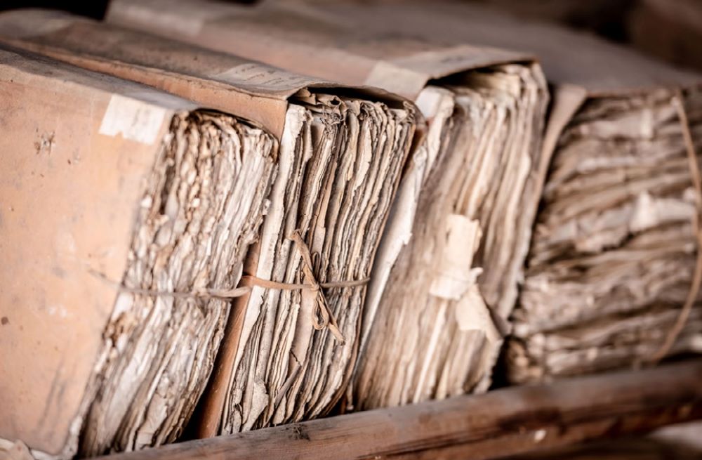 A row of bound sets of old paper