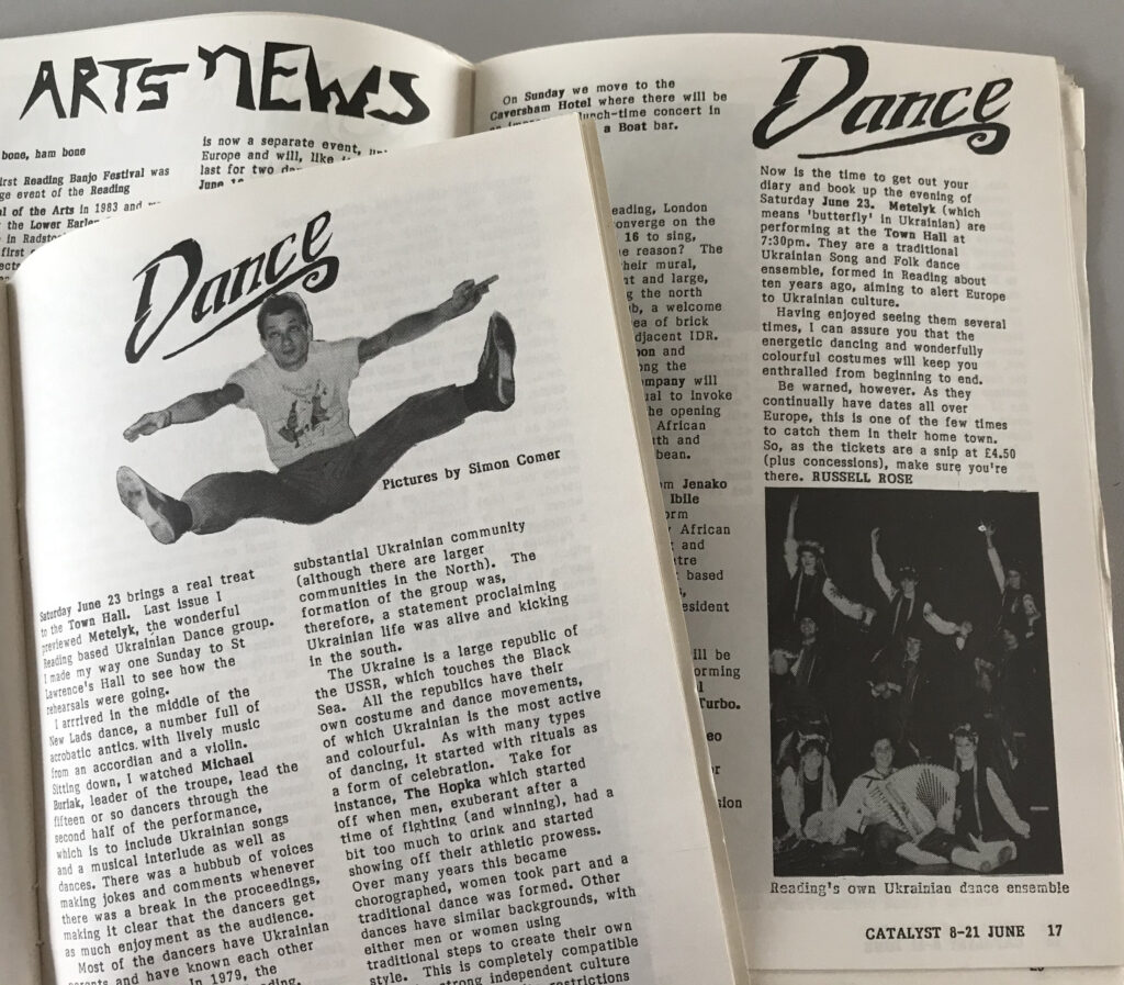 Several black-and-white magazines, one featuring a man jumping and doing the splits