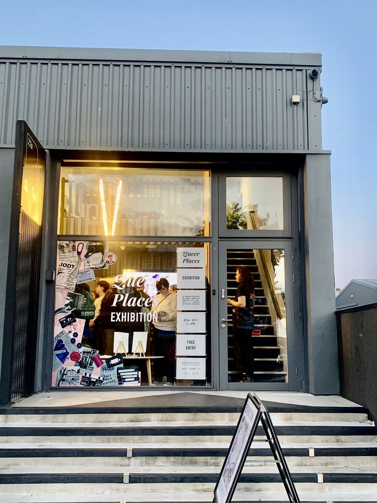 The glass front of the building hosting the Queer Places exhibition