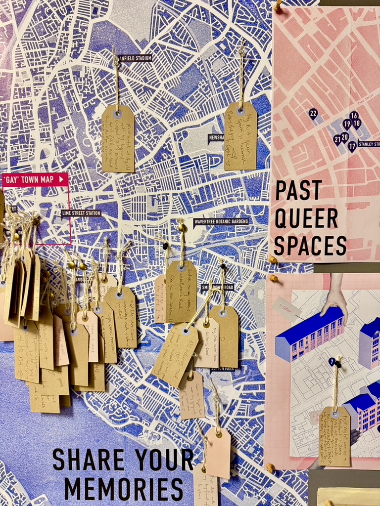 A map with the title 'Past Queer Spaces' and luggage tags hanging down from different points on the map