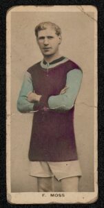 Sepia photo of Frank Moss, posing with his arms crossed, in his Aston Villa kit. The claret and blue colours have been colourised.