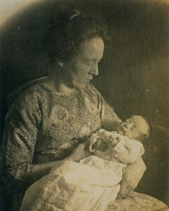 A mother holding her baby, born on New Years Eve, 1920.