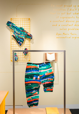A photograph from the Spirit of Invention exhibition showing the Petit Pli Mini Human trousers that grow as your child grows