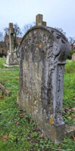 A photograph of the headstone of Ellen Pritty in a graveyard