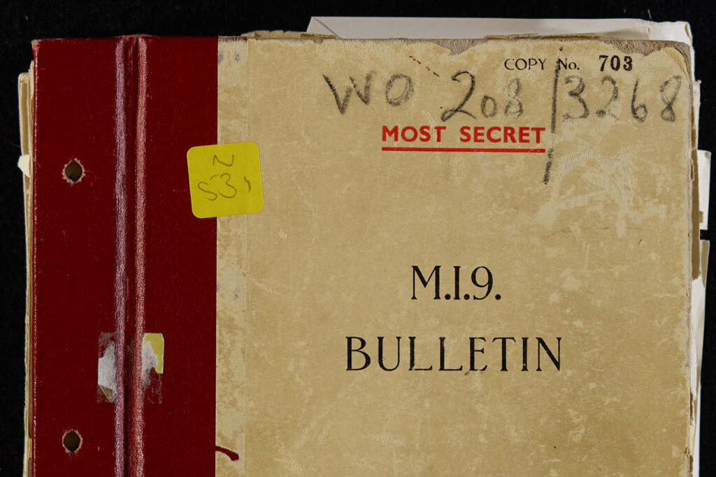 The front cover of a beige card file with red edging, with the words M.I.9.BULLETIN typed in capital letters on the front, and the words "Most Secret" in red