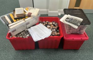 Five boxes containing small cardboard boxes and photographic negatives.