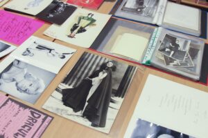 A collection of photographs and records, mainly showing costume designs and photographs of women. 