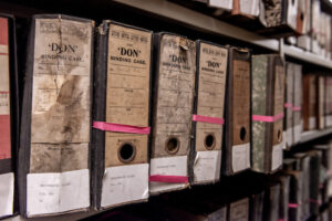 A close-up of uncatalogued folders held in a strongroom repository.